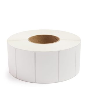 Roll of blank white adhesive labels on a cardboard core.