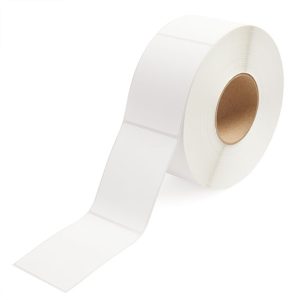 A roll of white adhesive labels on a brown cardboard core.