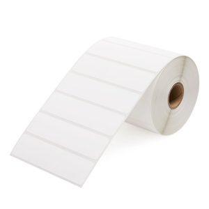 Roll of blank white adhesive labels on a cardboard core.