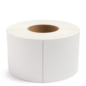A large roll of white labels with perforated edges on a cardboard core.