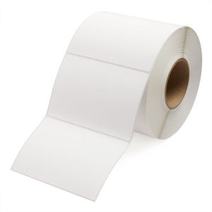 A roll of white adhesive labels on a cardboard core.